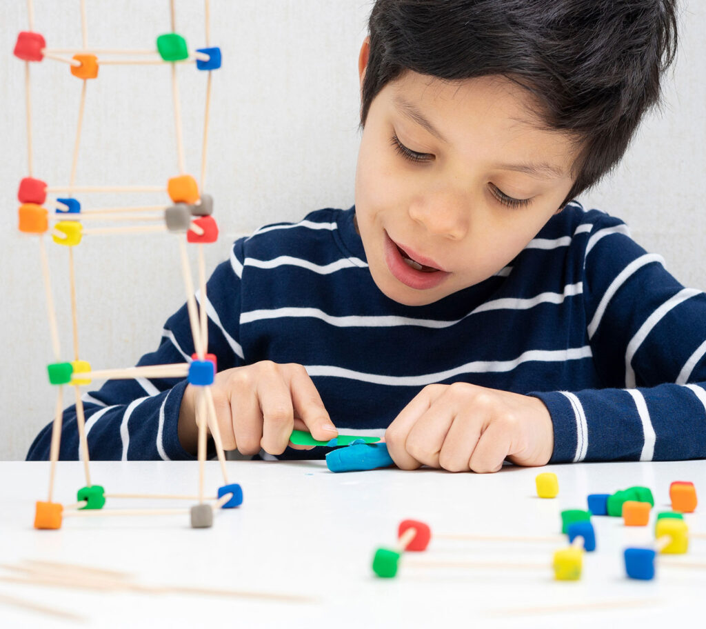 child using building toy